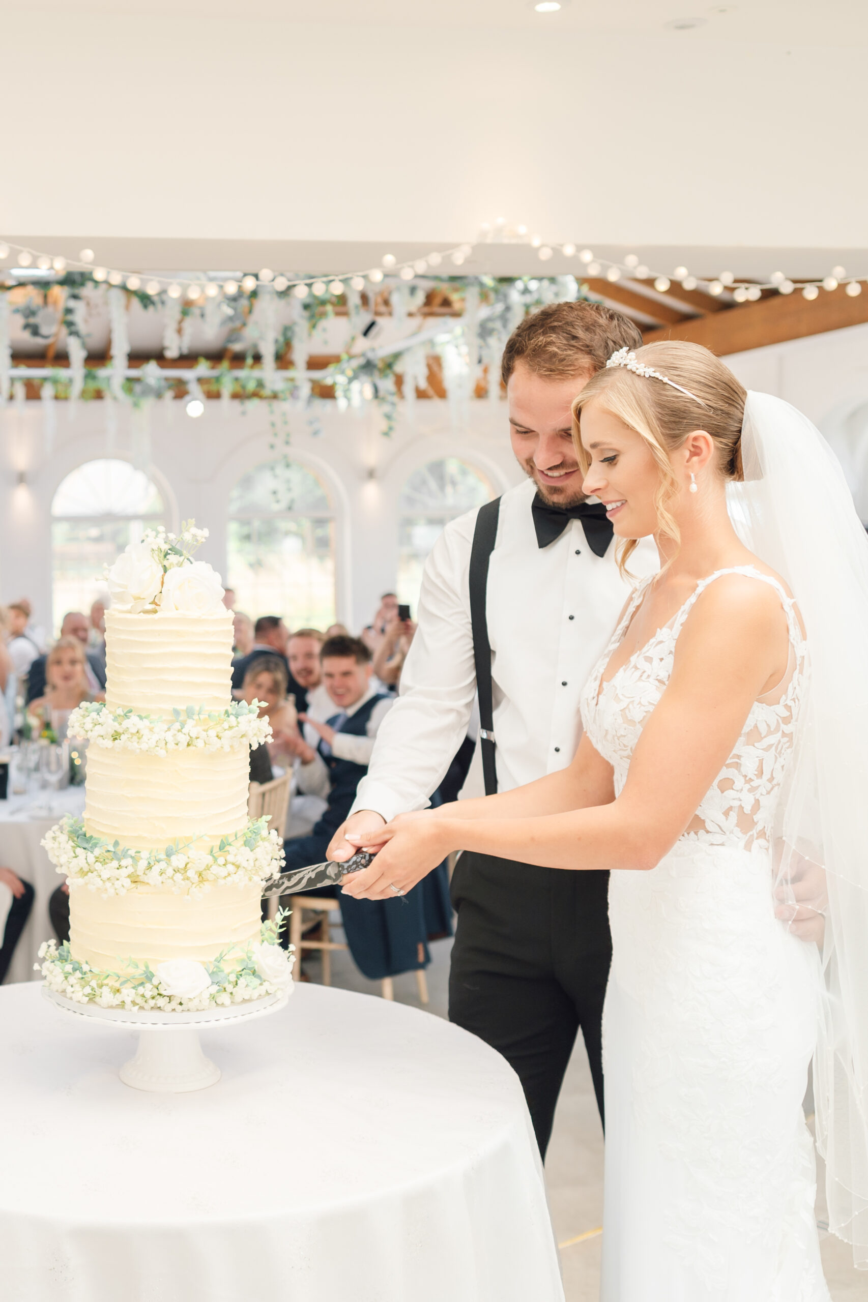 bride and groom cutting the cake