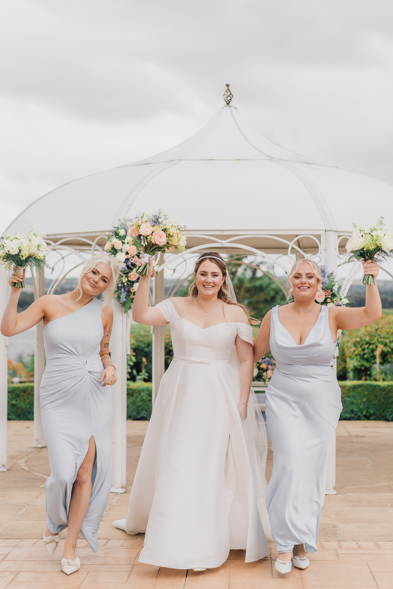 bridesmaids with flowers at wedding at rutland hall hotel 